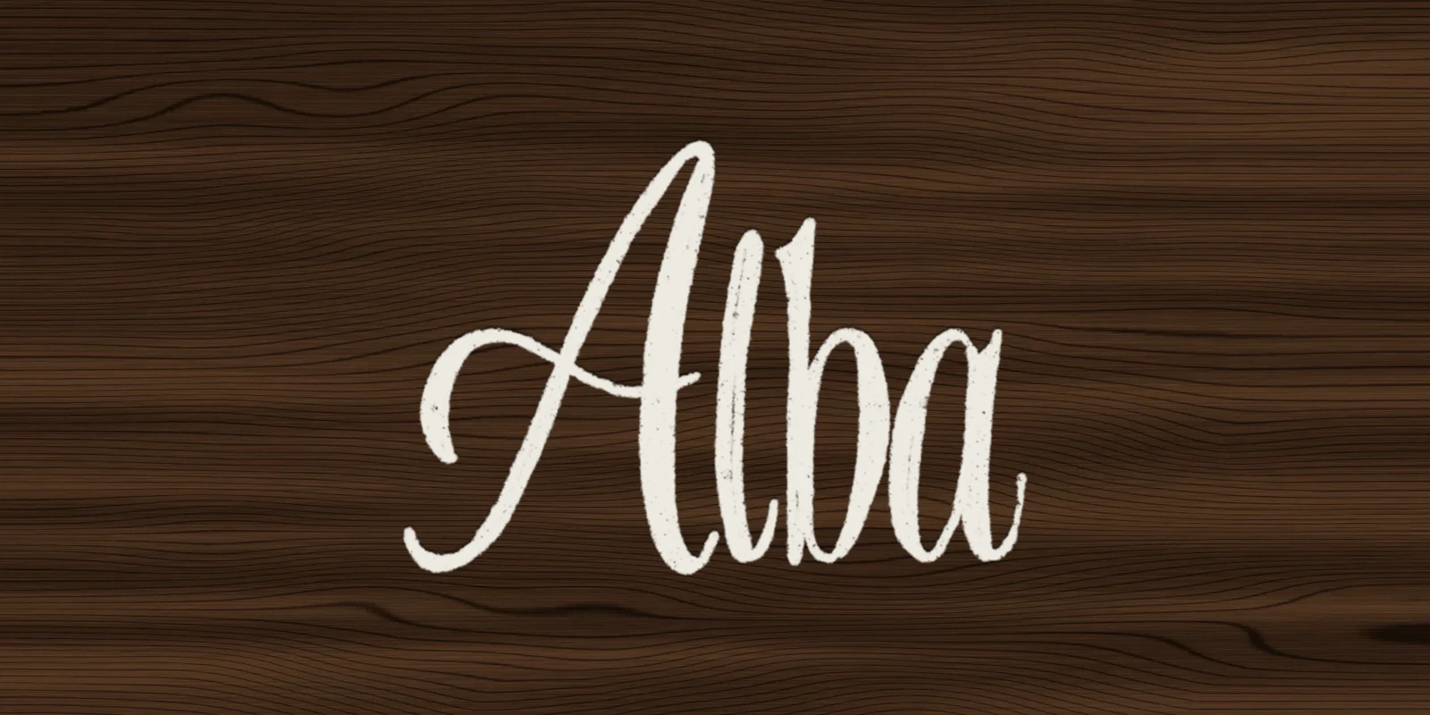 Alba script logo in cream on dark walnut wood